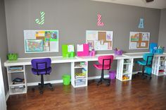 the children's desks are lined up against the wall with colorful chairs on them