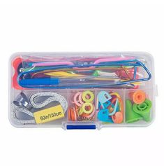 the plastic storage box has scissors and other items in it