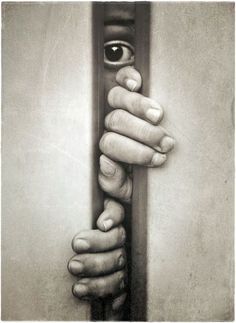 a hand holding onto the handle of a door with an eye in it's center