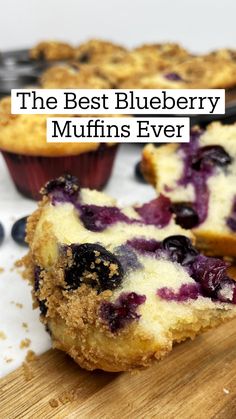 some blueberry muffins are on a cutting board