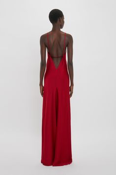 This 1990s-inspired camisole-slip dress has a bias cut for a flattering fit. A deep-V and scooped back create a sensuous silhouette, while delicate spaghetti strap detailing adds a sexy playfulness. With its floor-pooling hemline and confident shade of Poppy Red, it makes an assured statement. Victoria Beckham Low Back Cami Floor-Length Dress In Poppy Red  - Size 12 UK Red Silk Maxi Dress, Red Simple Dress, Long Red Dress Formal, Tailor Clothes, Prom Dress Uk, Simple Formal Dresses, Simple Red Dress, Simple Formal Dress, Wedding Party Dress Guest