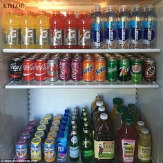 a refrigerator filled with lots of different types of drinks