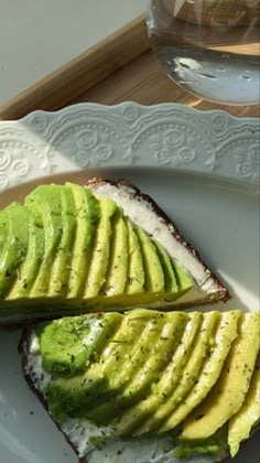 an avocado is cut in half on a plate