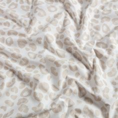 a white and brown animal print fabric