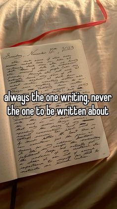 an open notebook with writing on it and the words always the one writing, never the one to be written about