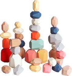 an assortment of wooden blocks and shapes on a white background, including one block stack