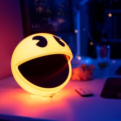 a smiley face light sitting on top of a desk