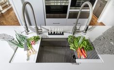 the kitchen sink is clean and ready to be used as a dishwasher or drainer