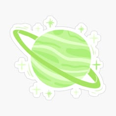 a green saturn sticker with stars around it and the planet in the center, on a white background