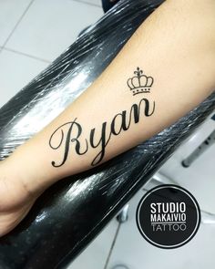 a person with a crown tattoo on their arm that reads, ryan studio makivo tattoo