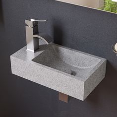 a bathroom sink with a faucet and soap dispenser