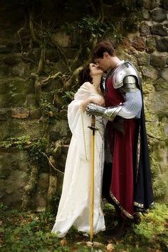 a man and woman dressed up as knights kissing each other with the words tell him he's your knight in shining armor