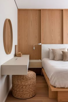 a large bed sitting next to a wooden wall