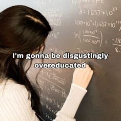 a woman writing on a blackboard with the caption i'm goma be disgustingly overed