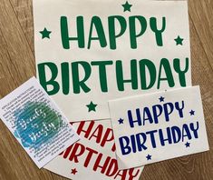 happy birthday stickers are on top of a table next to a piece of paper