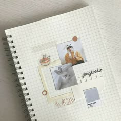 an open notebook with pictures and stickers on it