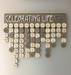 a wall mounted clock with the words celebrating life on it