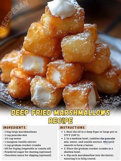 a pile of deep fried marshmallows sitting on top of a black plate