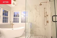 a white bathtub sitting next to a window in a bathroom