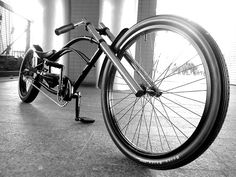 a black and white photo of a bicycle