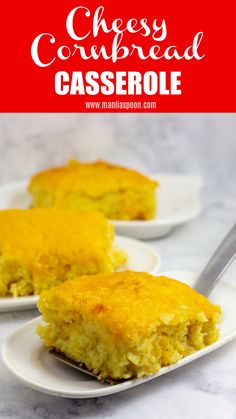 cheese cornbread casserole on two white plates with a spoon in the foreground