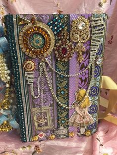 a purse with many different types of beads and chains on it's front side