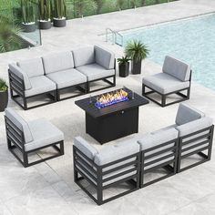 an outdoor fire pit surrounded by lounge furniture