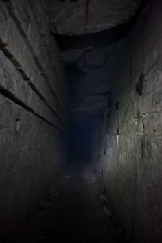 a dark tunnel with light at the end