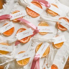 Each place card is made with an all natural dehydrated orange slice and your choice of ribbon color: dusty blue, copper, white or peony pink or custom ribbon upon request (Photos show custom orders) The place card itself is 1' x 3" made from 100lb  Bristol Vellum with a slight  surface. Cards have a hand torn, deckled edge or specify in notes if you wish a clean cut edge. Orange And Pink Wedding, Card For Wedding, Bridal Shower Inspo, Citrus Wedding, Christmas Pine Cones, Orange Party, Wedding Name Cards, Orange Slice, Dried Oranges