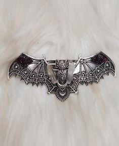 Whimsical Hand saudred stainless steel Bat hair pin. Featuring gorgeous detail in the bat pattern with added mini lumerian points, and garnet gemstone  this hair pin is on the heavier side so I'd recommend using it for thicker hair Vampire Goth Accessories, Bat Accessory, Goth Hair Clips, Bat Hair Accessories, Goth Hairclip, Gothic Hair Accessories, Cool Hair Designs, Gothic Hairstyles, Rose Quartz Gemstone