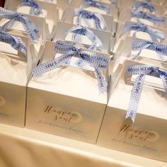 several boxes with blue ribbon tied around them