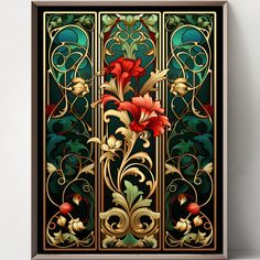 an art nouveau design with red flowers on green and gold foiled glass, framed against a white wall