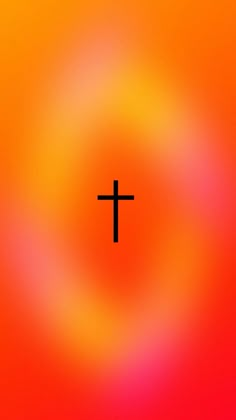 the cross is in front of an orange and red background