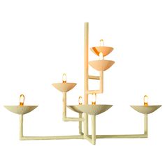 a chandelier with five candles on each candle holder