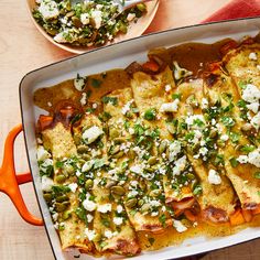 a casserole dish with vegetables and feta cheese