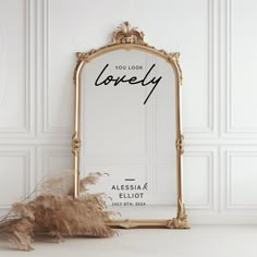 an ornate gold framed mirror with the words you look lovely written in black on it