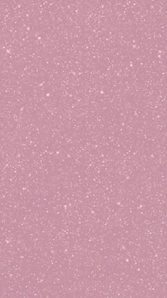 a pink background with white speckles on it