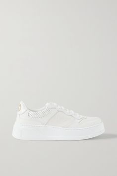 Gucci's sneakers are a stylish celebration of the house's roots - they're adorned with the iconic interlocking 'GG' logo first created by the founder's son in the '30s. Made in Italy from leather, they have perforations and are set on chunky rubber soles subtly carved with the brand's moniker. Gucci Sneakers White, Gucci Shoes Women Sneakers, Gucci White Sneakers, White Gucci Shoes, Tenis Gucci, Gucci Shoes Women, Sneakers Gucci, Gucci Shoes Sneakers, Shoes Heels Classy