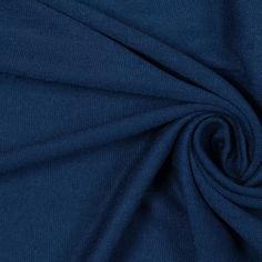 a close up shot of the fabric on a dark blue shirting material that is very soft