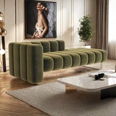 a modern living room with green velvet sofas and coffee table in front of a painting on the wall