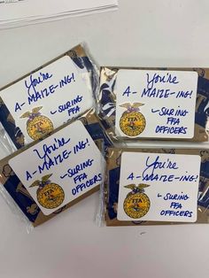 four packaged cookies with writing on them