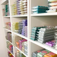 the shelves are filled with many different colored items