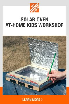 a person holding a green pencil in front of an open box with the words solar oven at - home kids workshop