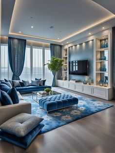 a living room filled with furniture and a flat screen tv on top of a wall