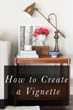 a table with flowers and books on it in front of a white wall that says how to create a vignette