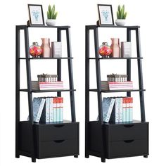 two black bookshelves with drawers and pictures on them