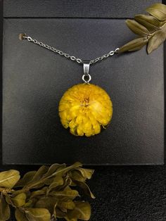 Discover the Beauty of Nature and Elegance in One - Our Handmade Chrysanthemum Pendant. 🌼 Exquisite Craftsmanship: Each pendant is a unique masterpiece, meticulously handcrafted from real chrysanthemum and jewelry epoxy resin. Please note that hardware may vary slightly, ensuring your pendant is truly one-of-a-kind. 🍃 Preserved Natural Beauty: The chrysanthemum inside this pendant is beautifully preserved, creating a timeless piece that may differ slightly from the one shown in the photo. This Chrysanthemum Necklace, Tanning Bed, Ball Necklace, Flower Jewelry, Keep Jewelry, Love Symbols, Flower Jewellery, Chrysanthemum, Microfiber Cloth