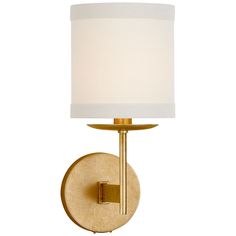 a wall light with a white shade on the side and a gold metal frame around it