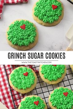 cookies with green frosting and red hearts on top are sitting on a cooling rack