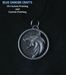 the blue danube crafts pendant is shown on a black background